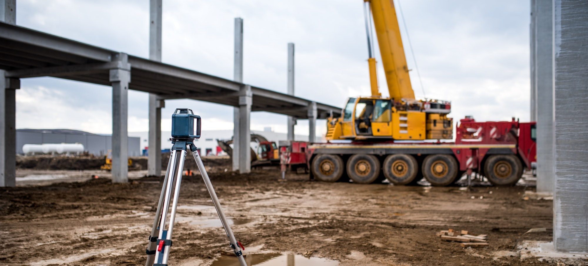 Industrial engineering with theodolite, gps, total station and tools at construction site